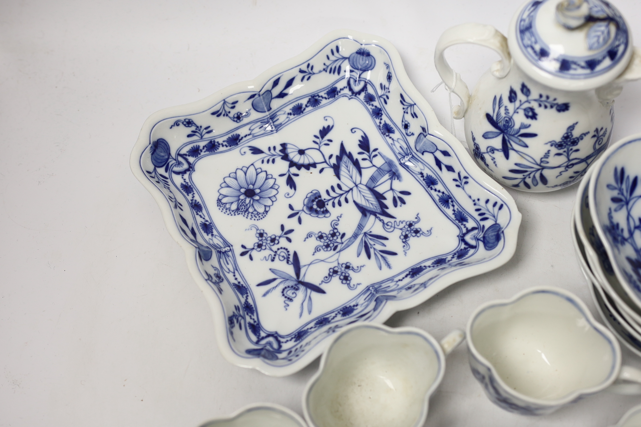Fourteen Meissen items including a coffee pot, five cups and saucers, a square dish and oval dish, and a posy vase, coffee pot 16cm